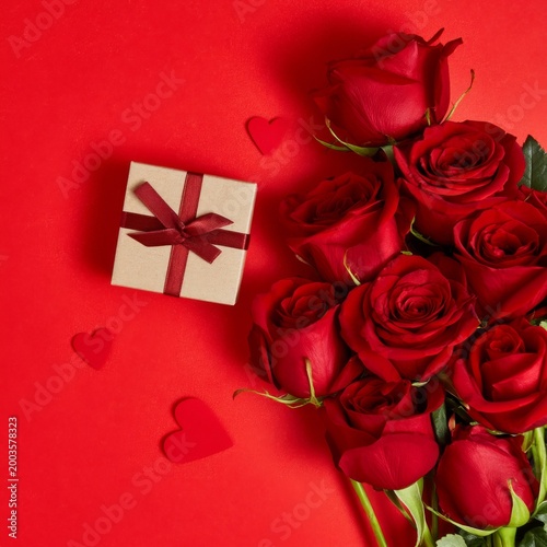 Roses and Gift Box on Red Background for Special Occasion Celebration