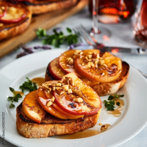 Grilled Toast With Peaches and Walnuts on a White Plate With Drinks in the Ba...