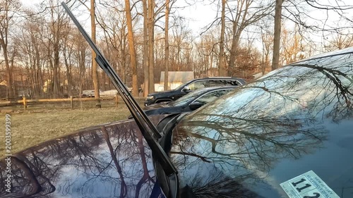 putting the cars wipers up before the snow storm