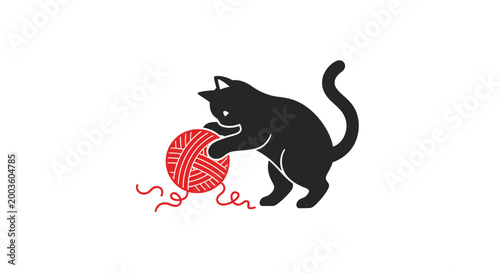 Tableau sur toile Black cat playing with yarn ball.
