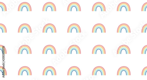 Seamless pattern of cute pastel rainbows on white background