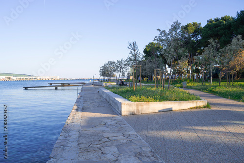  Modern seaside promenade with pine trees and stone pavement in Zadar, Croatia, 26.04.2026