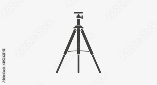 Black tripod for camera equipment.