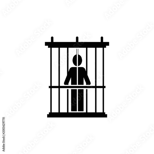 Silhouette of a Person Standing Behind Jail Bars