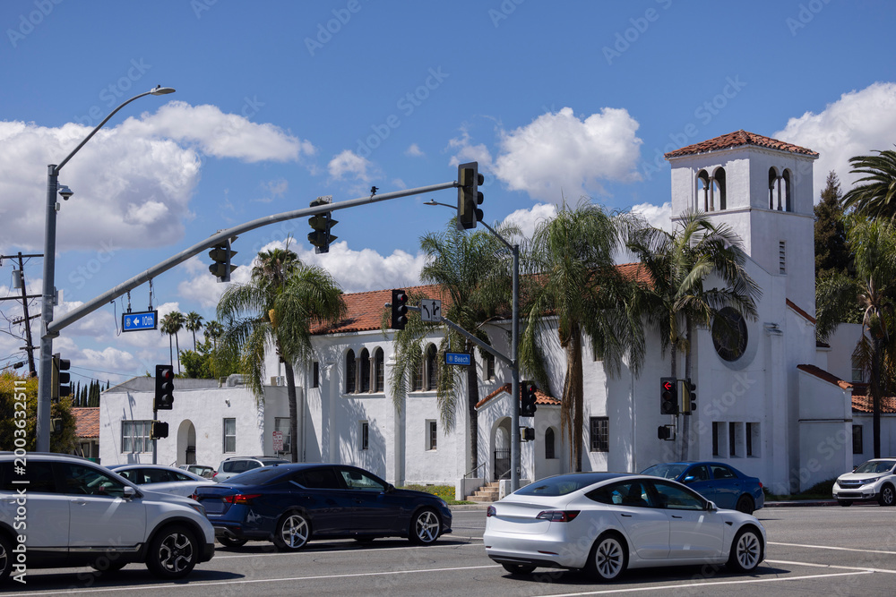 Naklejka premium Afternoon sun shines on a historic church in downtown Buena Park, California, USA.