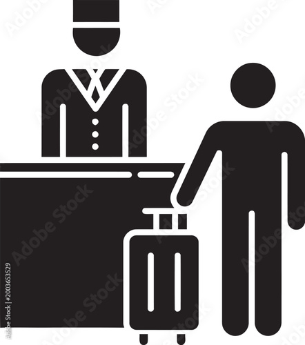 Hotel guest checking in at reception desk