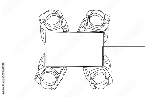 Continuous line drawing of four astronauts holding a large blank marketing ad paper together from overhead view. This outer space science concept is a fantastic option for a school educational poster.