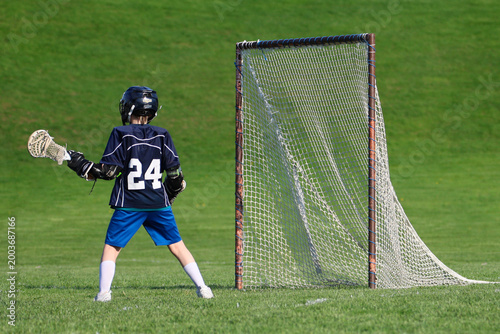 Boy playing Lacrosse game
