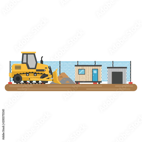 This vector illustration depicts a construction site featuring a yellow bulldozer, a portable office, and a storage shed behind a wire fence.