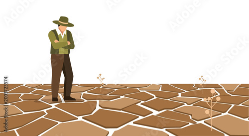Farmer in arid landscape with cracked earth