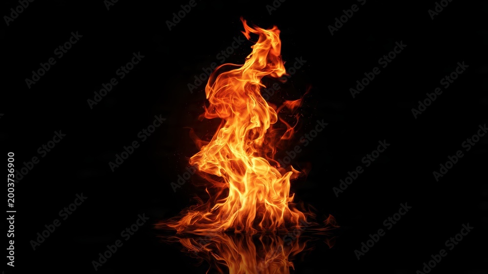Fototapeta premium A tall column of bright orange and yellow fire dances against a stark black background with a subtle reflection below
