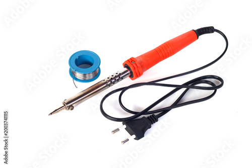 Slika na platnu Electric soldering iron with metal tip and spool of solder wire isolated on white background