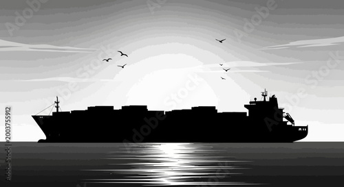 Silhouette of a cargo ship at sunset.