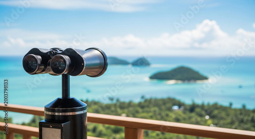 Tourist binoculars overlooking tropical islands and turquoise sea