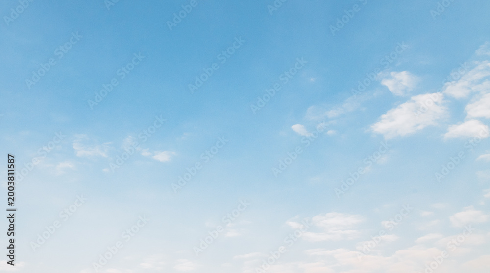 Fototapeta premium the sky is clear blue with fluffy white clouds, the sky is very bright, and the sun shines.