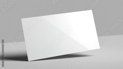 Blank rectangular card mockup floats slightly above a smooth surface in a neutral  setting