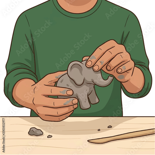 Person shaping a small clay elephant sculpture with hands and tools.
