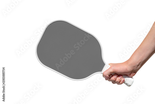 A close shot of a hand gripping a gray pickleball  paddle, set against a transparent background. Perfect for sport, pickleball, and competition themes; conveys energy, focus, and skill.