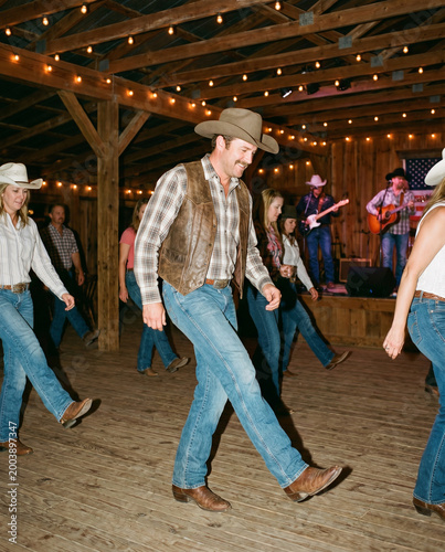 Man in Cowboy Attire Line Dancing
