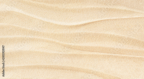 Natural wave pattern with horizontal lines on beach sand.