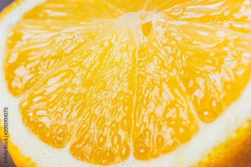 Close-up of fresh halved orange showing juicy pulp