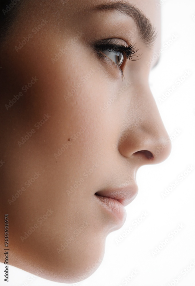 Fototapeta premium Profile view of a woman's eyes with perfect skin and makeup