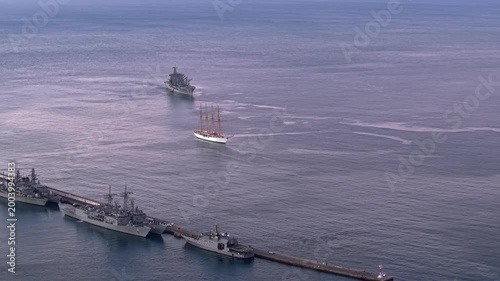 Aerial orbit of Chilean Navy warships in Valparaiso Bay with the training ship La Esmeralda, at dawn, Chile