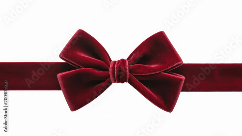 A dark red velvet ribbon tied into a bow isolated on a white background, for gift wrapping concepts