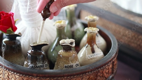 Фотография Hand Testing Jasmine Essential Oil in a Luxury Spa Setting