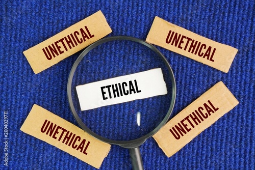 Canvas Print Magnifying glass with words Ethical and unethical, choosing ethical