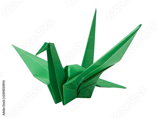 Green origami crane on white