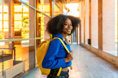 Young african student smiling on university campus