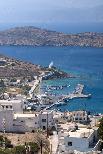 Panoramic view of the beautiful picturesque port of Ios Greece and the island of Sikinos in the background