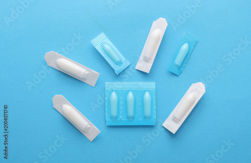 Obraz na płótnie Rectal suppositories on a blue background