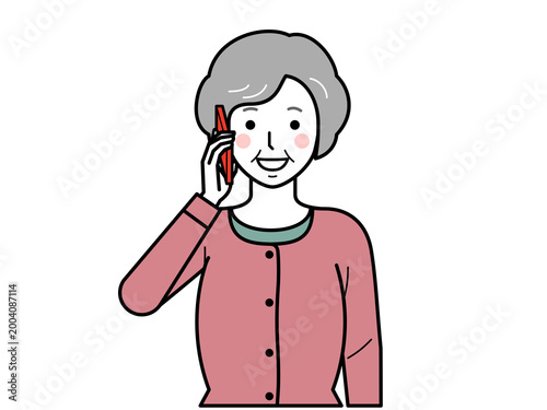 正面向き。スマホで電話をするカーディガンを着た高齢女性。その2