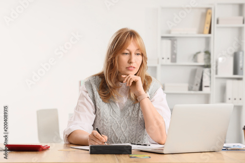 Female bank manager working...