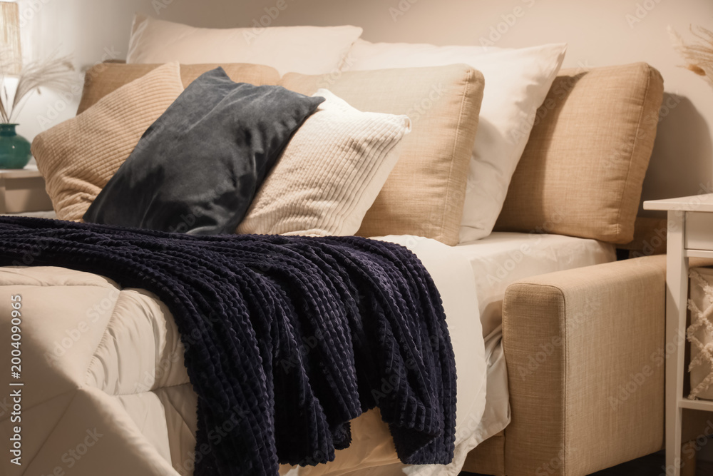 Ταπετσαρία Bed with cozy blanket and soft pillows in stylish bedroom at night, closeup