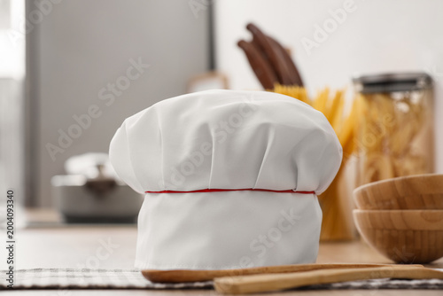Chef's hat, napkin and uten...
