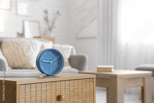 Alarm clock and magazine on...