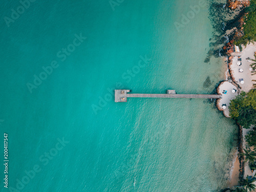 Bild auf Leinwand erial shot of a rustic wooden pier with turquoise sea background, Eastern Sea of Thailand