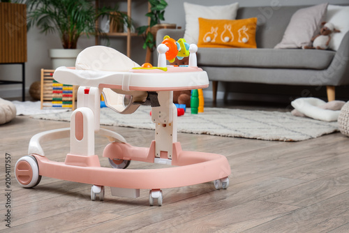Baby walker with toys in st...