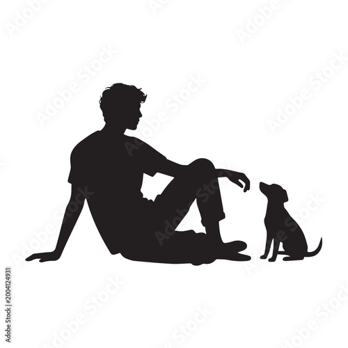 Silhouette of a Young Man Sitting on the Ground With His Small Puppy.