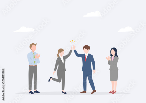 New Employee Celebrating Success with a High Five While Teammates Applaud