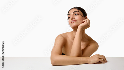 Fotografie Elegant woman leaning on hand with copy space in minimalist beauty portrait
