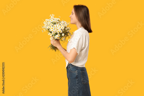 Happy young woman with bouq...