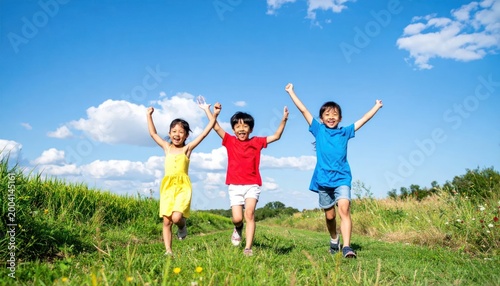 Three Happy Children Running Joyfully in a Sunny Green Field Under a Blue Sky.