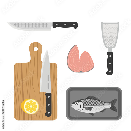 Foto Kitchen tools for fish preparation including cutting board sharp knives metal scaler fresh salmon steak and whole fish on tray with lemon slice isolated on white top