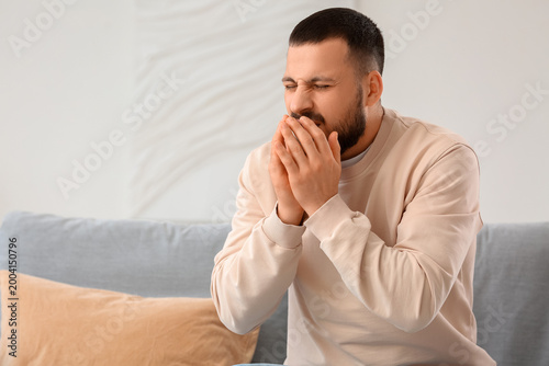 Sick young man suffering fr...