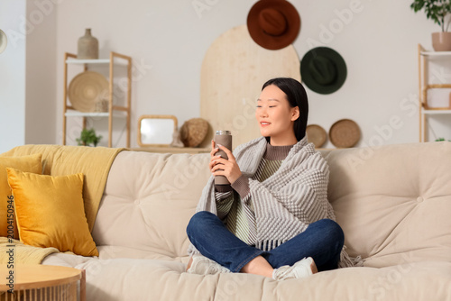Young Asian woman with ther...
