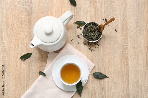 Cup and teapot of hot green...